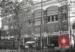 Image of An automobile almost hits pedestrians in center of a road Michigan United States USA, 1916, second 5 stock footage video 65675064462