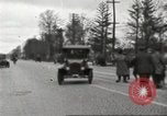 Image of An automobile almost hits pedestrians in center of a road Michigan United States USA, 1916, second 16 stock footage video 65675064462