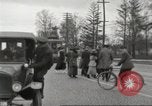 Image of An automobile almost hits pedestrians in center of a road Michigan United States USA, 1916, second 31 stock footage video 65675064462