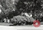 Image of An automobile almost hits pedestrians in center of a road Michigan United States USA, 1916, second 37 stock footage video 65675064462