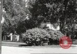 Image of An automobile almost hits pedestrians in center of a road Michigan United States USA, 1916, second 38 stock footage video 65675064462