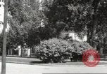 Image of An automobile almost hits pedestrians in center of a road Michigan United States USA, 1916, second 39 stock footage video 65675064462