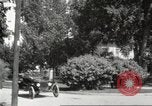 Image of An automobile almost hits pedestrians in center of a road Michigan United States USA, 1916, second 41 stock footage video 65675064462