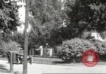 Image of An automobile almost hits pedestrians in center of a road Michigan United States USA, 1916, second 45 stock footage video 65675064462