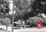 Image of An automobile almost hits pedestrians in center of a road Michigan United States USA, 1916, second 46 stock footage video 65675064462