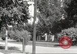 Image of An automobile almost hits pedestrians in center of a road Michigan United States USA, 1916, second 50 stock footage video 65675064462