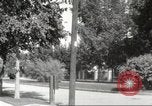 Image of An automobile almost hits pedestrians in center of a road Michigan United States USA, 1916, second 51 stock footage video 65675064462