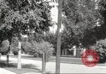 Image of An automobile almost hits pedestrians in center of a road Michigan United States USA, 1916, second 53 stock footage video 65675064462