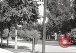 Image of An automobile almost hits pedestrians in center of a road Michigan United States USA, 1916, second 54 stock footage video 65675064462