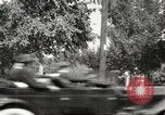 Image of An automobile almost hits pedestrians in center of a road Michigan United States USA, 1916, second 55 stock footage video 65675064462