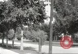 Image of An automobile almost hits pedestrians in center of a road Michigan United States USA, 1916, second 56 stock footage video 65675064462