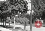 Image of An automobile almost hits pedestrians in center of a road Michigan United States USA, 1916, second 57 stock footage video 65675064462