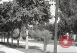 Image of An automobile almost hits pedestrians in center of a road Michigan United States USA, 1916, second 58 stock footage video 65675064462