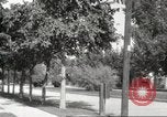 Image of An automobile almost hits pedestrians in center of a road Michigan United States USA, 1916, second 59 stock footage video 65675064462