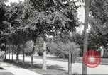 Image of An automobile almost hits pedestrians in center of a road Michigan United States USA, 1916, second 60 stock footage video 65675064462