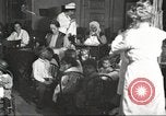 Image of teaching skills to American immigrants in early 1900s Detroit Michigan USA, 1919, second 3 stock footage video 65675064500
