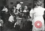 Image of teaching skills to American immigrants in early 1900s Detroit Michigan USA, 1919, second 4 stock footage video 65675064500