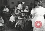 Image of teaching skills to American immigrants in early 1900s Detroit Michigan USA, 1919, second 5 stock footage video 65675064500