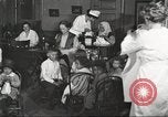 Image of teaching skills to American immigrants in early 1900s Detroit Michigan USA, 1919, second 6 stock footage video 65675064500