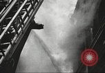 Image of building on fire London England United Kingdom, 1939, second 16 stock footage video 65675064530