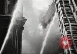 Image of building on fire London England United Kingdom, 1939, second 27 stock footage video 65675064530