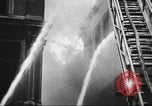 Image of building on fire London England United Kingdom, 1939, second 28 stock footage video 65675064530