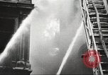 Image of building on fire London England United Kingdom, 1939, second 29 stock footage video 65675064530