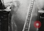 Image of building on fire London England United Kingdom, 1939, second 35 stock footage video 65675064530