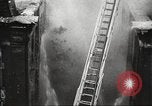 Image of building on fire London England United Kingdom, 1939, second 36 stock footage video 65675064530