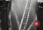 Image of building on fire London England United Kingdom, 1939, second 37 stock footage video 65675064530