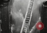 Image of building on fire London England United Kingdom, 1939, second 38 stock footage video 65675064530