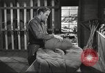 Image of skiing equipment United States USA, 1942, second 27 stock footage video 65675064554