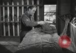 Image of skiing equipment United States USA, 1942, second 47 stock footage video 65675064554