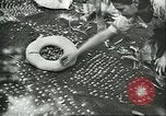Image of Brazilian rubber tree farmers for Ford Brazil, 1942, second 12 stock footage video 65675064715
