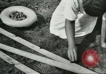 Image of Brazilian rubber tree farmers for Ford Brazil, 1942, second 55 stock footage video 65675064715
