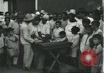 Image of Brazilian natives at market Brazil, 1932, second 43 stock footage video 65675064724