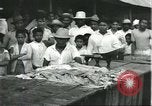 Image of Brazilian natives at market Brazil, 1932, second 45 stock footage video 65675064724