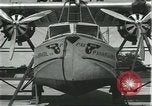 Image of Mechanics work on Consolidated Commodore flying boat Brazil, 1932, second 15 stock footage video 65675064725