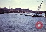 Immagine di Danneggiato le barche e gli edifici sulla costa nella seconda guerra mondiale Il Nord Africa, 1942, secondo 10 filmato di repertorio 65675065261