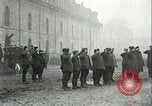 Image of U.S. troops raise flag on radio tower celebrating Armistice France, 1918, second 3 stock footage video 65675065322