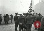 Image of U.S. troops raise flag on radio tower celebrating Armistice France, 1918, second 11 stock footage video 65675065322