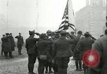 Image of U.S. troops raise flag on radio tower celebrating Armistice France, 1918, second 12 stock footage video 65675065322