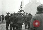 Image of U.S. troops raise flag on radio tower celebrating Armistice France, 1918, second 14 stock footage video 65675065322