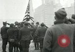 Image of U.S. troops raise flag on radio tower celebrating Armistice France, 1918, second 16 stock footage video 65675065322