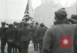 Image of U.S. troops raise flag on radio tower celebrating Armistice France, 1918, second 20 stock footage video 65675065322