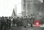 Image of U.S. troops raise flag on radio tower celebrating Armistice France, 1918, second 21 stock footage video 65675065322