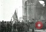 Image of U.S. troops raise flag on radio tower celebrating Armistice France, 1918, second 22 stock footage video 65675065322