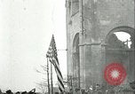 Image of U.S. troops raise flag on radio tower celebrating Armistice France, 1918, second 25 stock footage video 65675065322