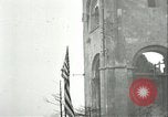 Image of U.S. troops raise flag on radio tower celebrating Armistice France, 1918, second 26 stock footage video 65675065322
