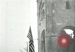 Image of U.S. troops raise flag on radio tower celebrating Armistice France, 1918, second 27 stock footage video 65675065322